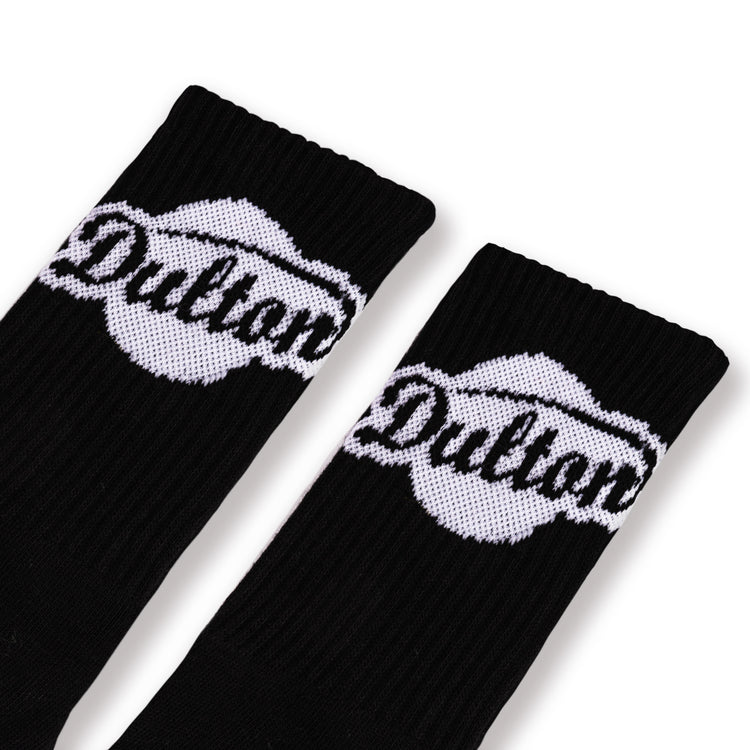 A pair of black socks with 'DULTON' branding on the ankle area.