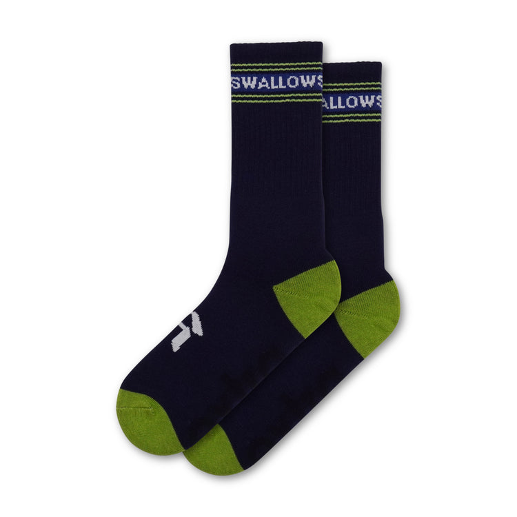 Pair of dark blue socks with green toes and cuffs on a white background with "swallows" in white