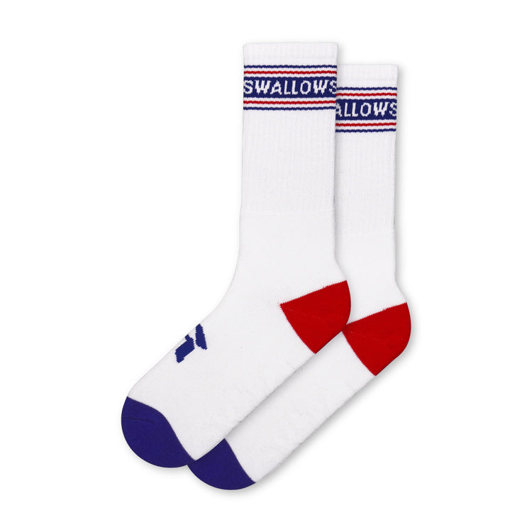 White socks with red and blue accents on a white background with the word "swallow" on the upper leg portion