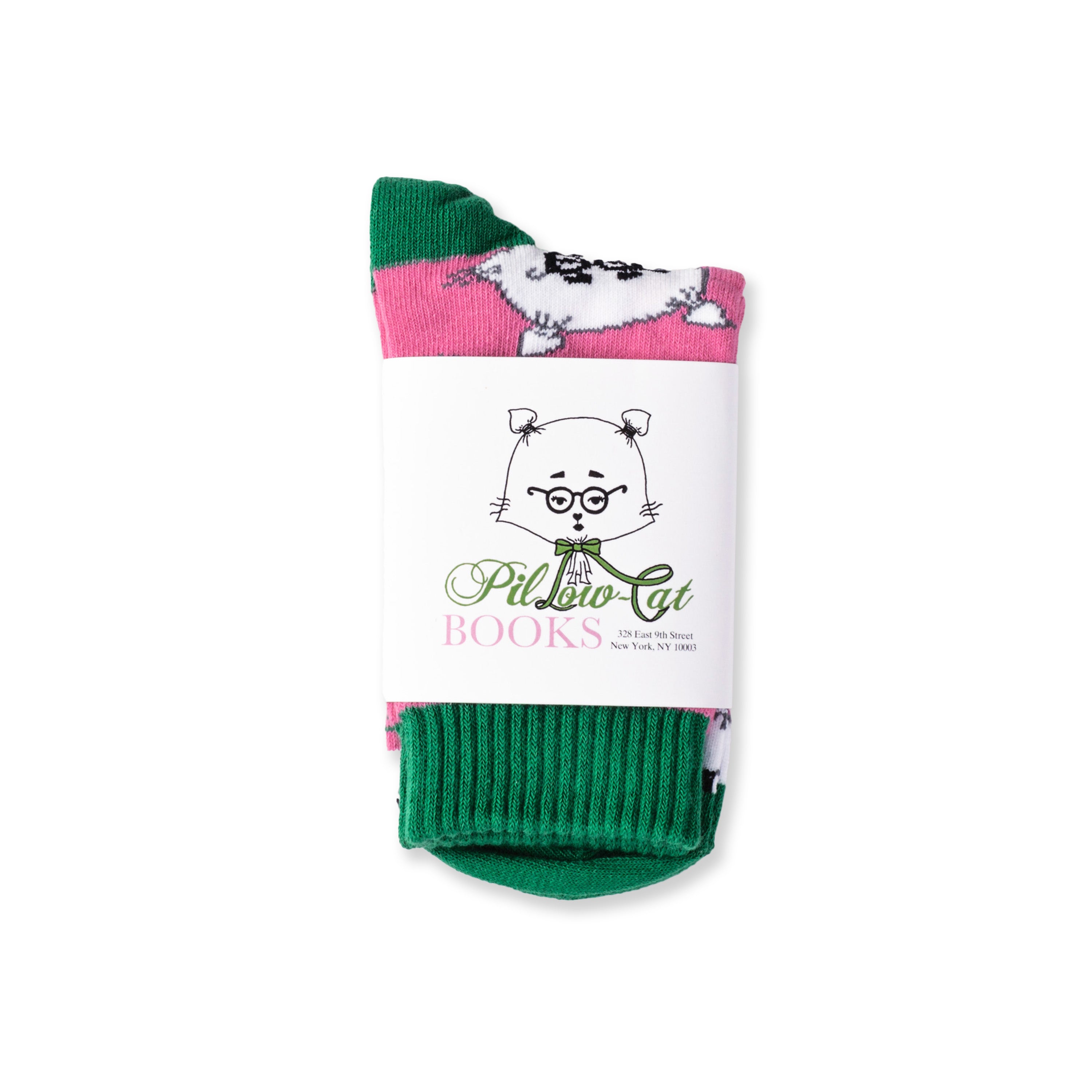 A pair of pink and green socks featuring a repeated pattern of a stylized, cartoon-like cat with glasses and a bow tie packaged in a branded wrap.