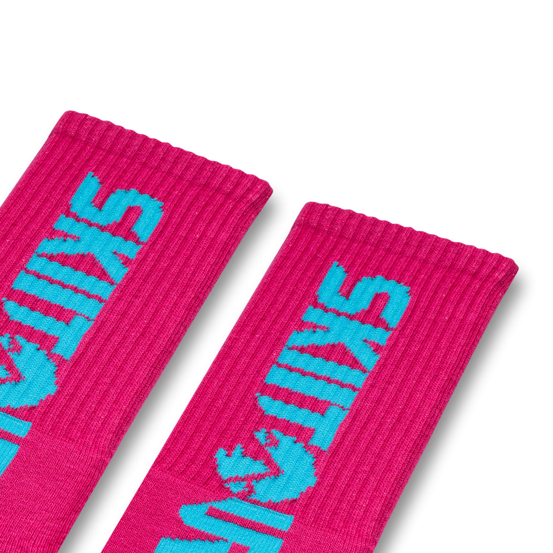 A pair of pink and blue colored socks with 'Skiitour' branding on the ankle area.