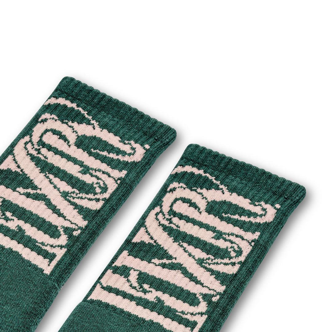 Green & pink socks with "Luxury Spa" branding
