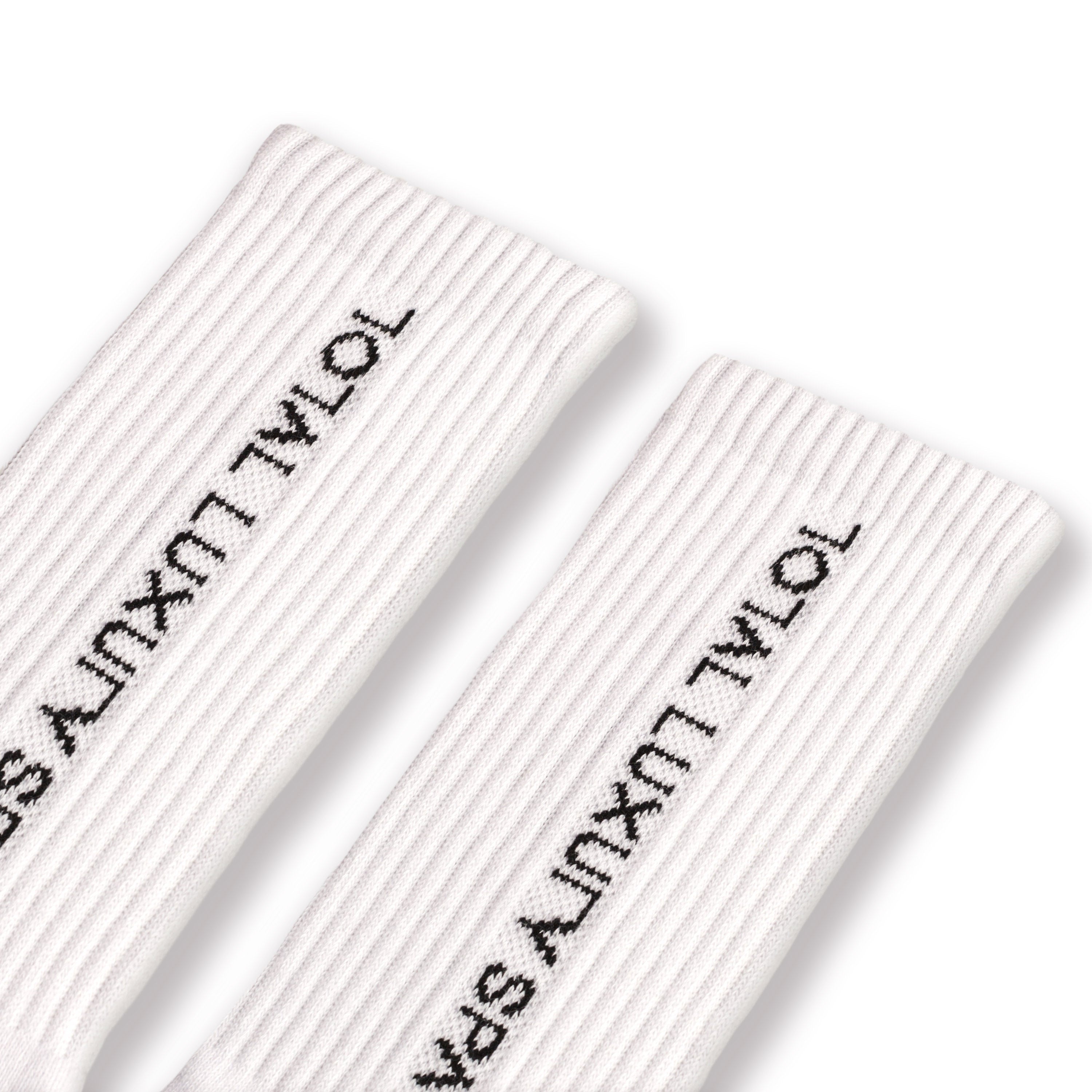 White socks with "total luxury spa" branding