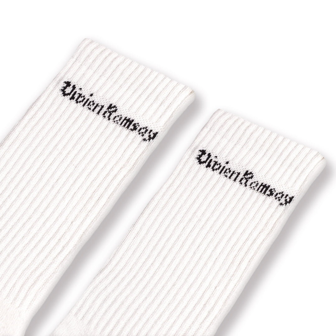 A pair of white Vivien Ramsey socks with the brand name on the ankle area.