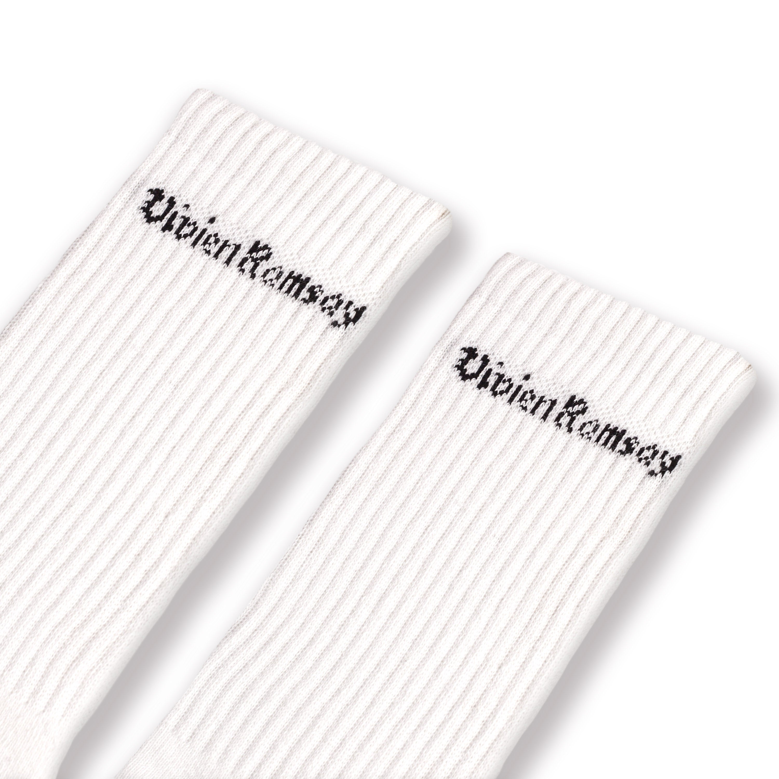 A pair of white Vivien Ramsey socks with the brand name on the ankle area.