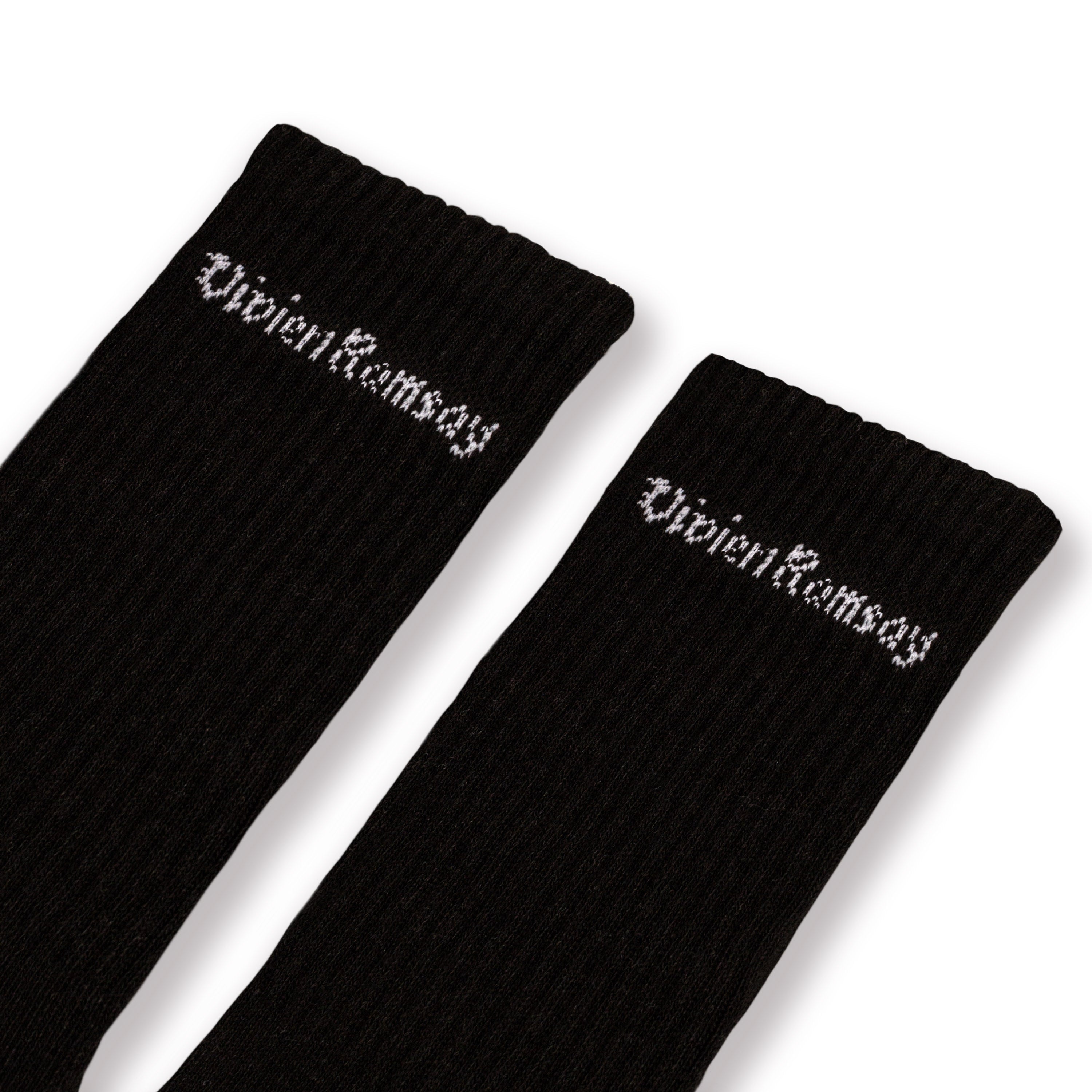 A pair of Black Vivien Ramsey socks with the brand name on the ankle area.