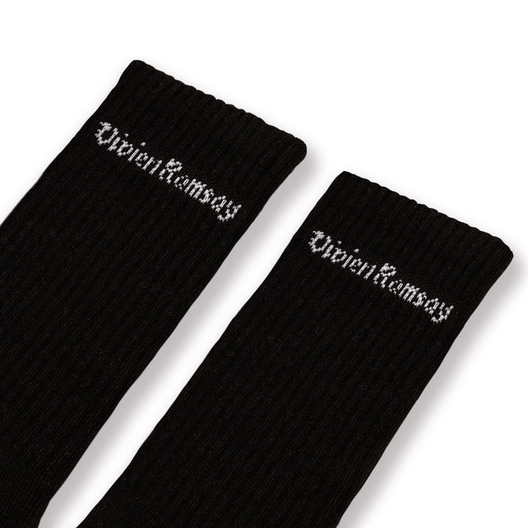 A pair of Black Vivien Ramsey socks with the brand name on the ankle area.