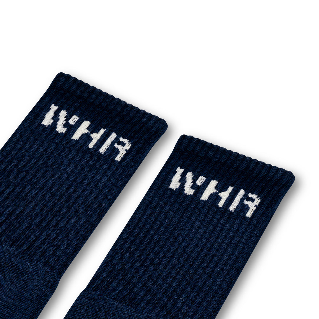 Navy socks with "WHR" branding on the ankle