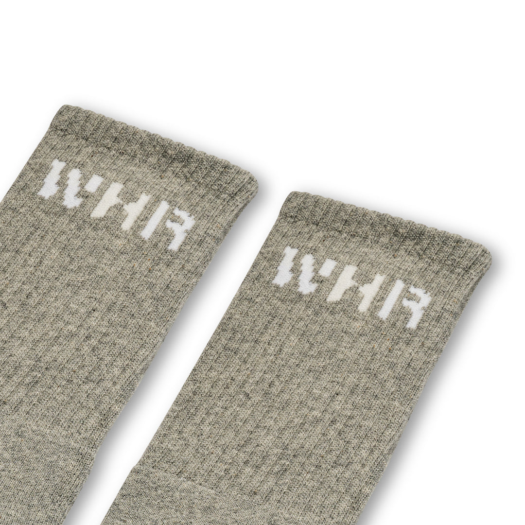 Grey socks with "WHR" on the ankle