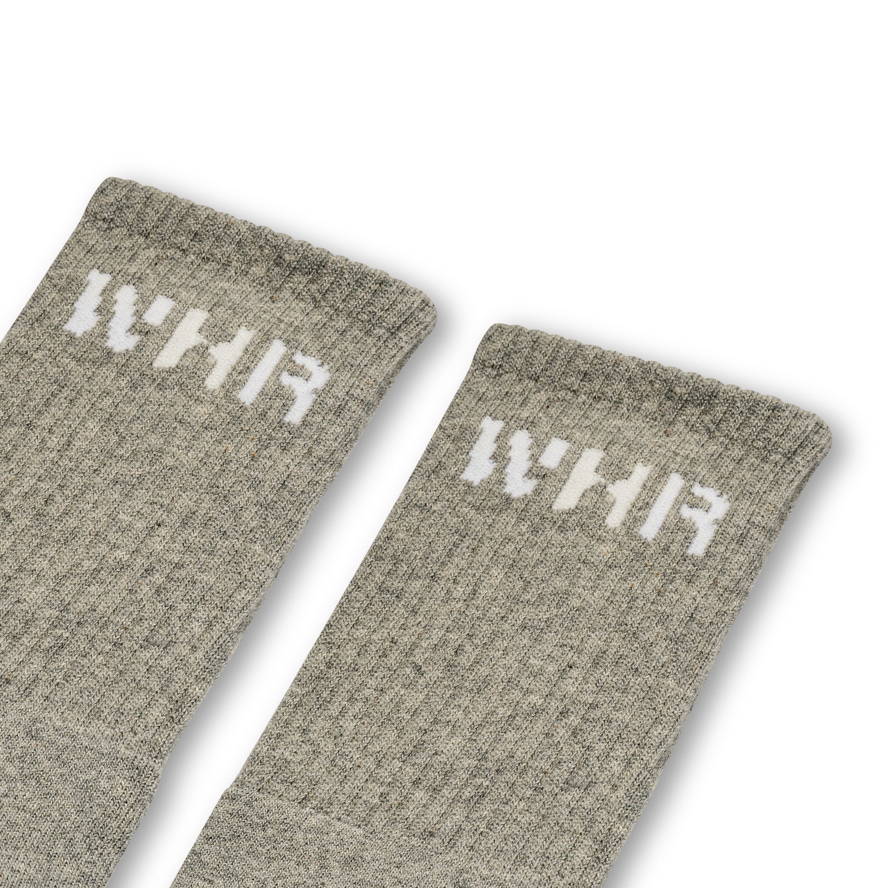 Grey socks with "WHR" on the ankle