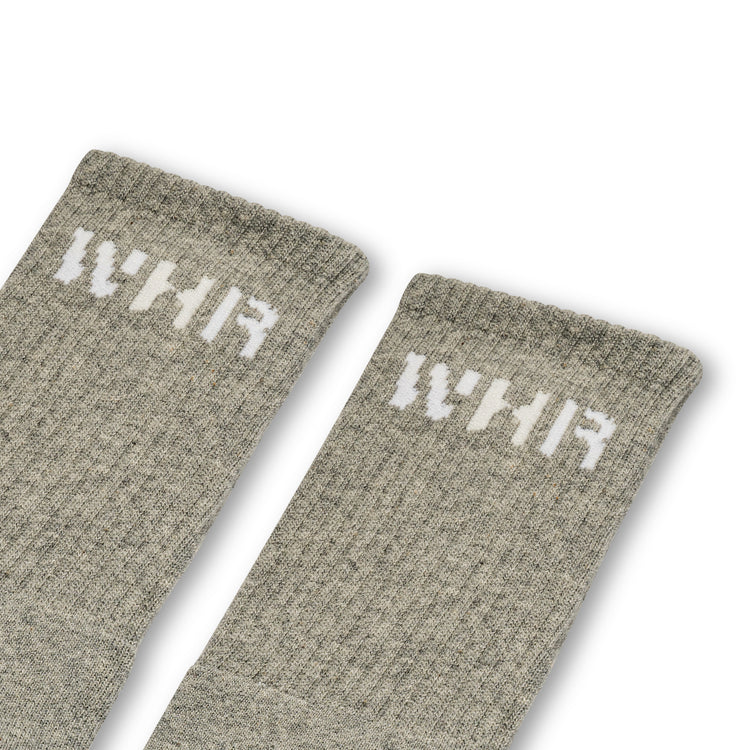 Grey socks with "WHR" on the ankle