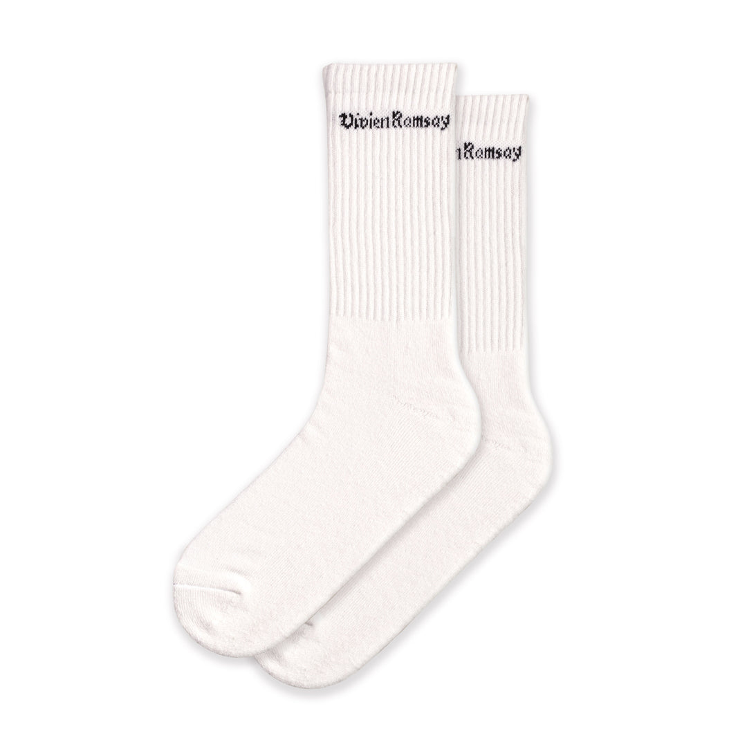 A pair of white Vivien Ramsey socks with the brand name on the ankle area.