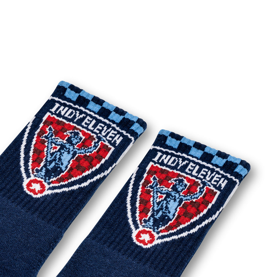 Navy socks with The Shop Indy branding on the ankle
