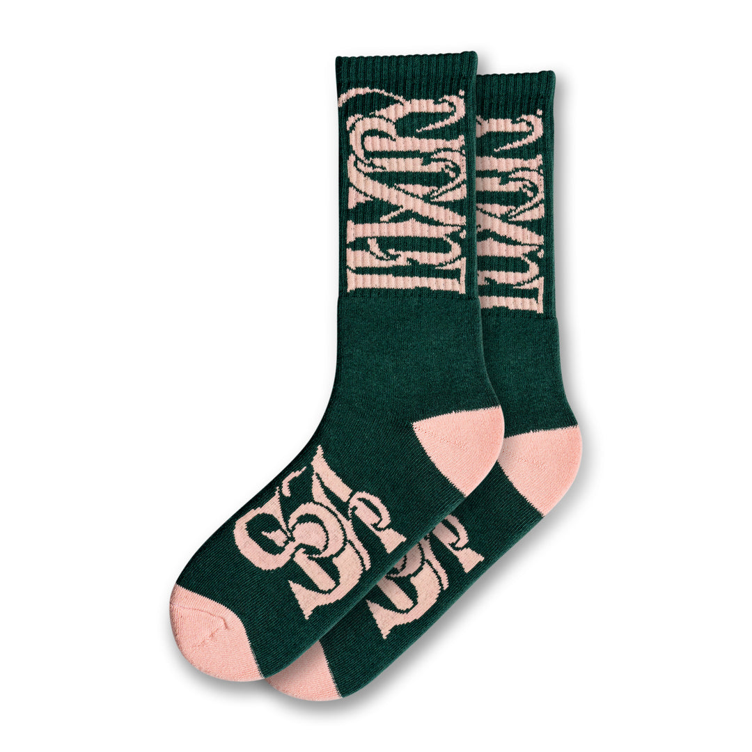 Green & pink socks with "Luxury Spa" branding