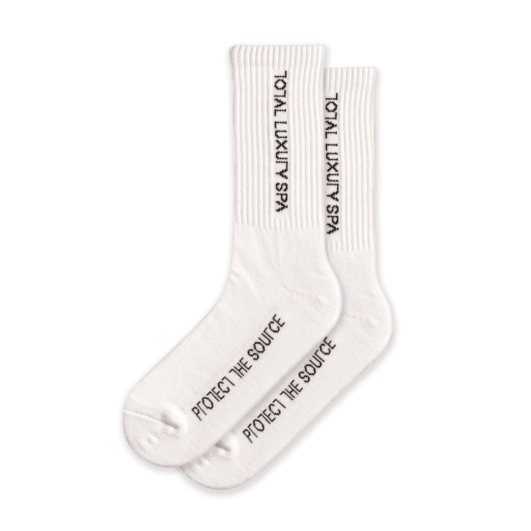White socks with "total luxury spa" branding