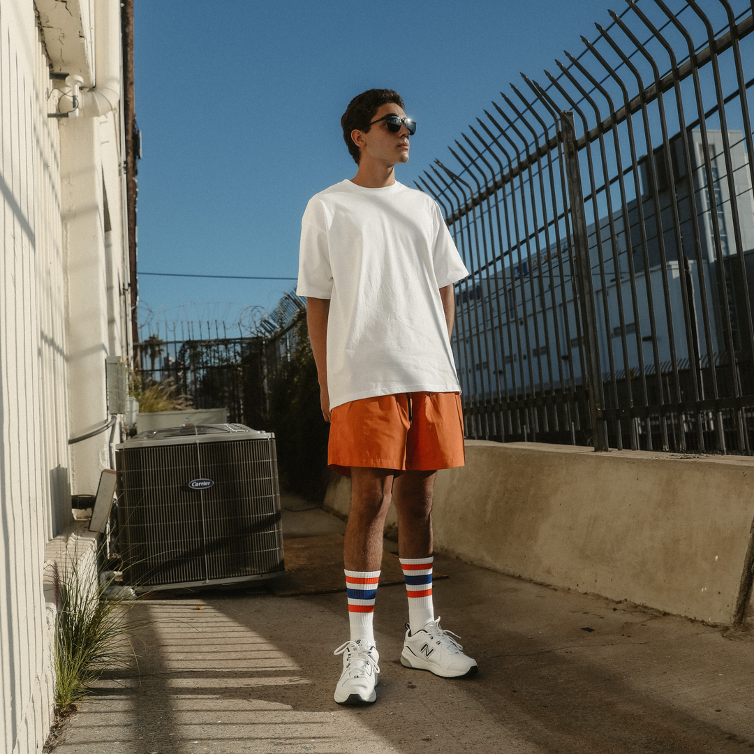 Greg wearing Extra Point Three Stripe Socks with Orange and Royal Blue stripes. Perfect for NY Knicks or Denver Broncos. Photo by Erica Joan