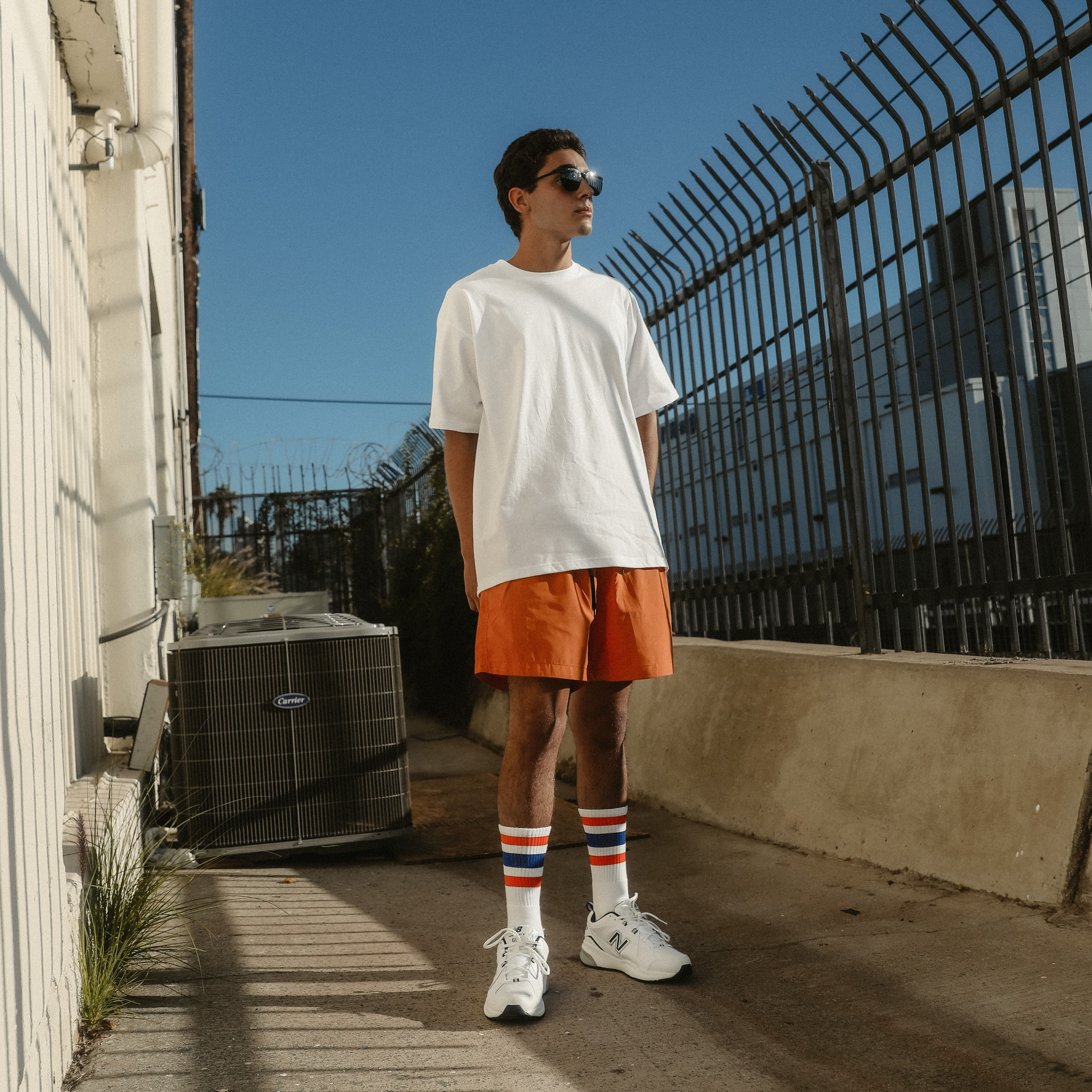 Greg wearing Extra Point Three Stripe Socks with Orange and Royal Blue stripes. Perfect for NY Knicks or Denver Broncos. Photo by Erica Joan