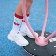 Olivia Wardlow wearing Extra Point Cherry Socks. She is roller skating with the socks