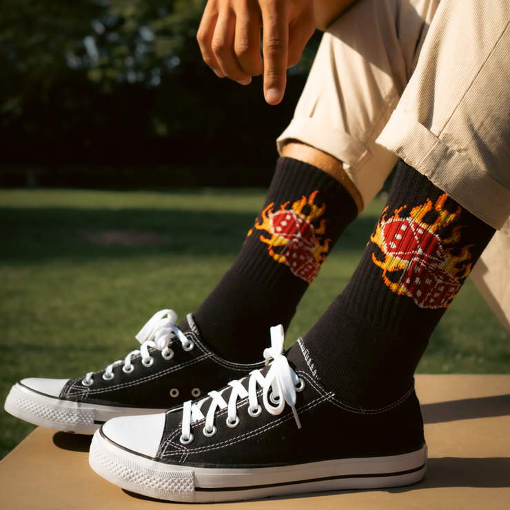 model sitting on the bench and  wearing Extra Point Dice on Fire Socks 