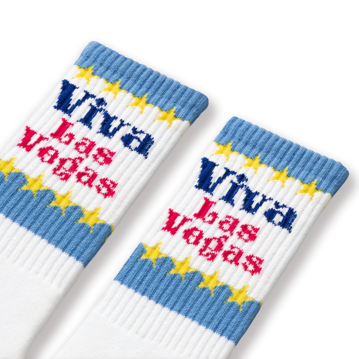 A pair of white socks with blue and yellow &