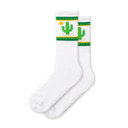 A pair of white socks with green and yellow cactus designs and a small cactus flower detail.