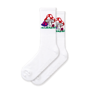 A pair of white crew socks with a mushroom design, featuring various mushroom shapes and a field of colorful flowers.