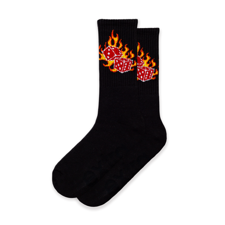 A pair of black socks with a flaming dice design.